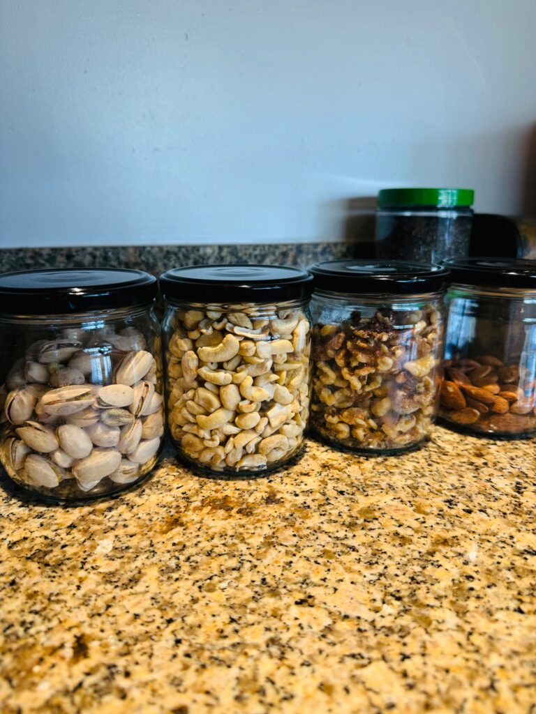 Jars of nuts beautifully organized to promote healthy snacking