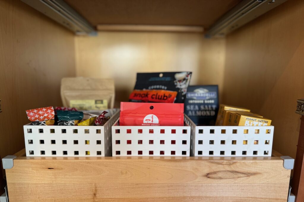 Organized kitchen pantry with healthy snacks in reach